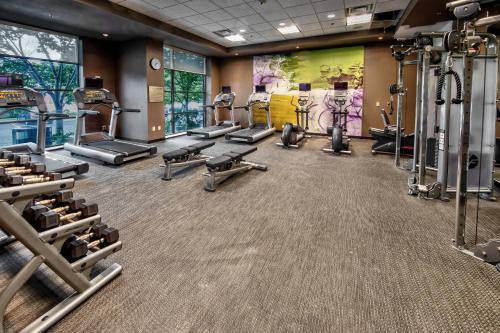 a gym with several treadmills and cardio equipment at Courtyard by Marriott Dulles Airport Herndon in Herndon