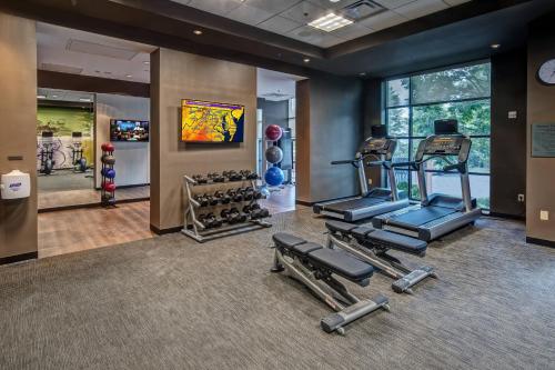 a gym with cardio equipment in a hotel room at Courtyard by Marriott Dulles Airport Herndon in Herndon