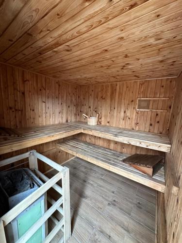 an inside of a wooden sauna with a wooden ceiling at Zawoja domki z jacuzzi, domek w stylu góralskim in Zawoja