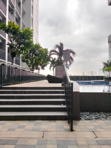a set of stairs leading to a pool in a building at VSV Luxury Family Suite staycation Moa shore2 tower2 unit1122 in Manila