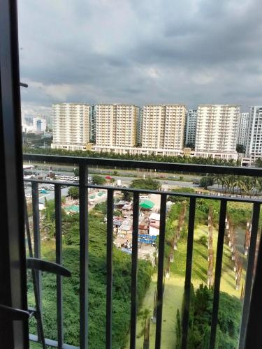 a view of a city from a balcony at VSV Luxury Family Suite staycation Moa shore2 tower2 unit1122 in Manila