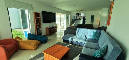 a living room with a couch and a table at Luxury Villas in Vila Franca do Campo