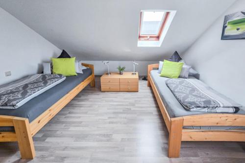 Postel nebo postele na pokoji v ubytování PREMIUM Ferienwohnung Michelau