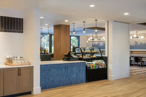 a kitchen with a blue counter top in a room at Delta Hotels by Marriott Jacksonville Deerwood in Jacksonville