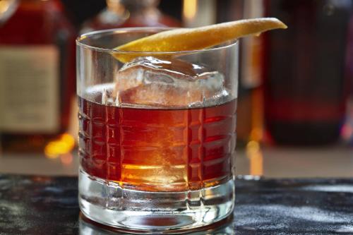 a drink with a orange slice in a glass at Renaissance São Paulo Hotel in Sao Paulo