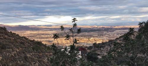 a view of a valley with mountains in the distance at Casa Rural La Fuensanta in Mojácar