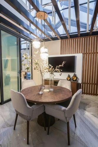 a dining room with a wooden table and chairs at Sheraton Quito in Quito