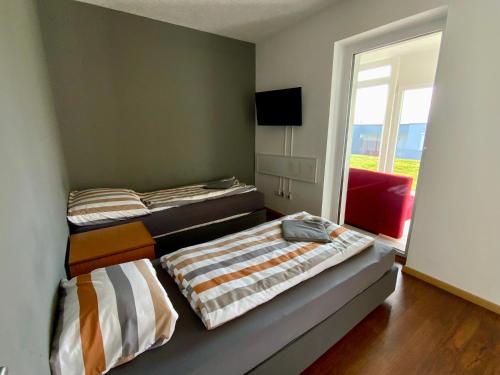 Cama o camas de una habitación en Geinberg Suites & Via Nova Lodges