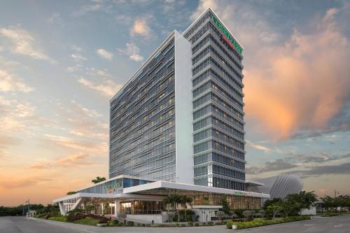 a rendering of a tall white building at Courtyard by Marriott Iloilo in Iloilo City