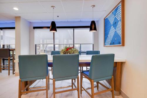 a dining room with a table and chairs at Holiday Inn Express Wilkes Barre East by IHG in Wilkes-Barre