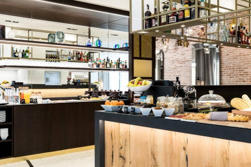 a kitchen with a buffet of food on a counter at AC Hotel Venezia by Marriott in Venice