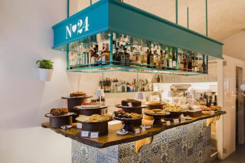 a buffet of food and drinks on a table at Santa Maria 24 in Monopoli