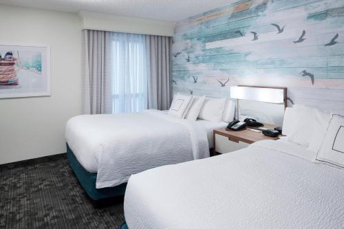 Cama o camas de una habitación en Courtyard Carolina Beach Oceanfront