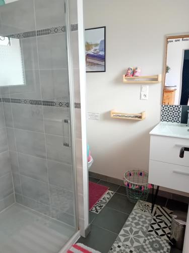 a shower with a glass door in a bathroom at Un séjour entre Nîmes et Montpellier in Souvignargues