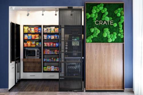 a grocery store with a sign of grapes on the wall at Courtyard by Marriott Indianapolis Fishers in Fishers