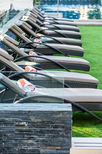 a row of baseball bats sitting in a dugout at Renaissance Santiago by Marriott in Santiago