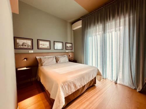 Llit o llits en una habitació de B&B Donna Ca'