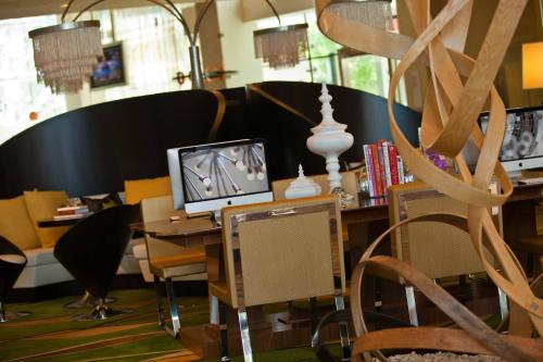 an office with a desk with a computer on it at Renaissance Arlington Capital View Hotel in Arlington