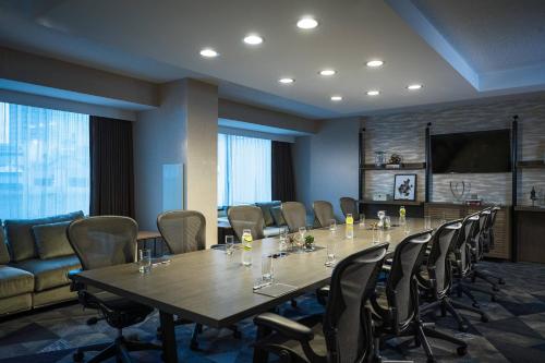 a conference room with a long table and chairs at Renaissance Toledo Downtown Hotel in Toledo