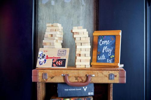 a table with a stack of bricks and a box at Moxy Washington, DC Downtown in Washington