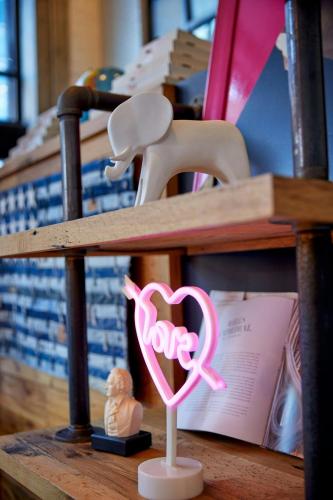 a toy heart with the word love on a table at Moxy Washington, DC Downtown in Washington
