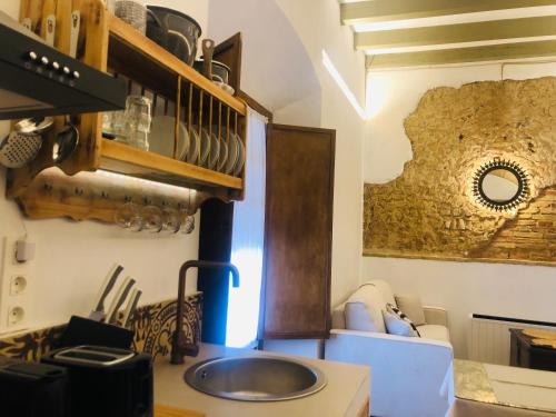a kitchen with a sink and a counter at La casa grande in Carmona