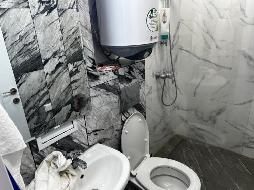 a bathroom with a toilet and a sink at Obzor in Obzor