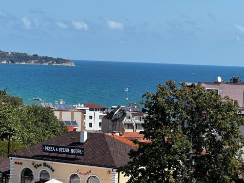 a view of a city with the ocean in the background at Obzor in Obzor