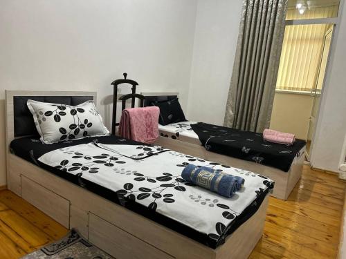 two beds in a room at Humo Family Home - гостевой дом in Tashkent