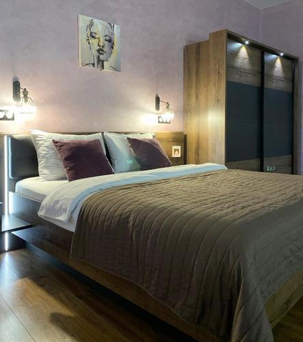 En eller flere senge i et værelse på Apartment ЖД вокзал, Центр