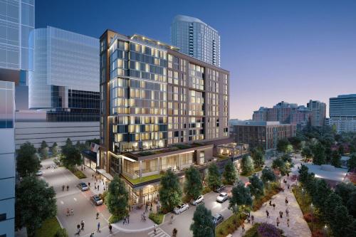 a rendering of a tall building in a city at AC Hotel by Marriott Reston in Reston