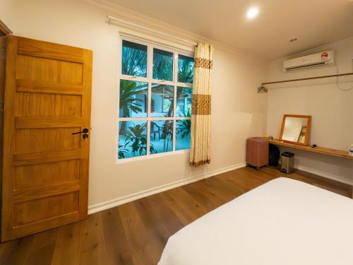 Postel nebo postele na pokoji v ubytování Noorani Retreat Dhiffushi