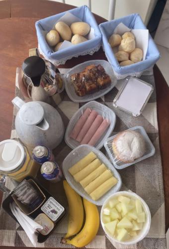 a table topped with lots of different types of food at Pousada Estância da Pinha in Santo Antônio do Pinhal