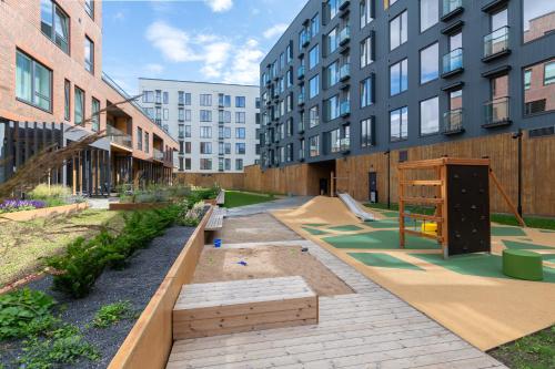 a courtyard in a building with a skate park at Revalia Lastekodu-Odra Bus Station Airport Apartments in Tallinn