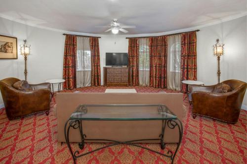 a living room with a table and two chairs at Casa Monica Resort & Spa, Autograph Collection in Saint Augustine