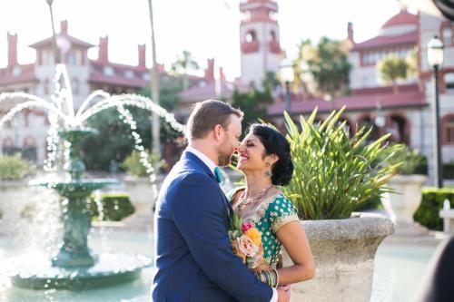 a man and a woman standing in front of a fountain at Casa Monica Resort & Spa, Autograph Collection in Saint Augustine