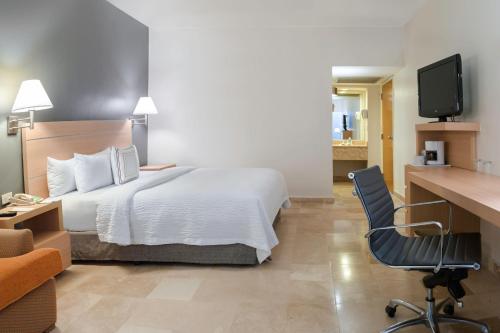 Μια τηλεόραση ή/και κέντρο ψυχαγωγίας στο Courtyard by Marriott Villahermosa Tabasco