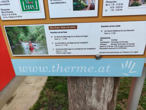 a sign for the wu the theme at the water park at Ferienwohnung Waldblick, nahe Jennersdorf und Therme in Windisch Minihof