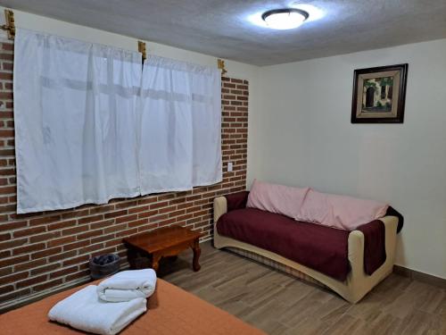 Postel nebo postele na pokoji v ubytování Cabaña La Hacienda 1