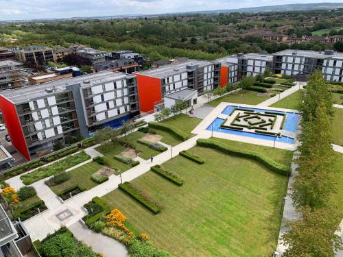 an aerial view of a park with buildings at Vizion Suites Milton Keynes - Free WiFi, Netflix Secure, Parking, Fully Furnished & Equipped Apartments in Milton Keynes