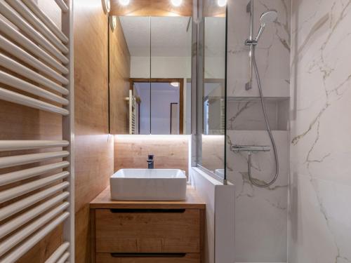 a bathroom with a sink and a shower at Appartement rénové skis aux pieds avec parking couvert, au cœur de Val-d'Isère - FR-1-694-280 in Val dʼIsère