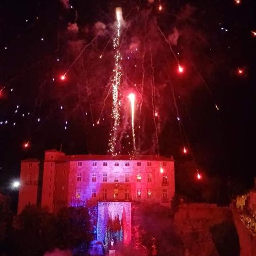 a building with fireworks exploding in the sky at la bergerie des colles in Entrecasteaux