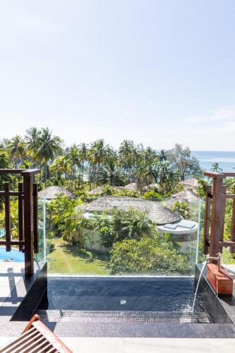 a view of the ocean from the balcony of a resort at Ajinta Resort in Ko Kood