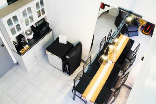 an overhead view of a salon with a table and chairs at Caryolba hometel - Calapan in Calapan