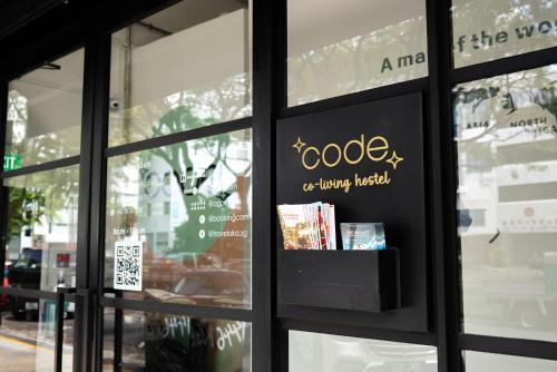 a sign in the window of a book store at Code Hostel at Lavender in Singapore