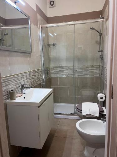 a bathroom with a shower and a sink and a toilet at Appartamenti la Piazzetta vicino a Firenze in Signa