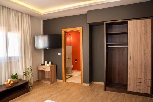 a room with a bathroom with a toilet and a mirror at Al Dora Resort All Inclusive Hotel in Hurghada