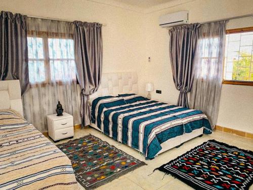 Ένα ή περισσότερα κρεβάτια σε δωμάτιο στο Maison Fatouakia