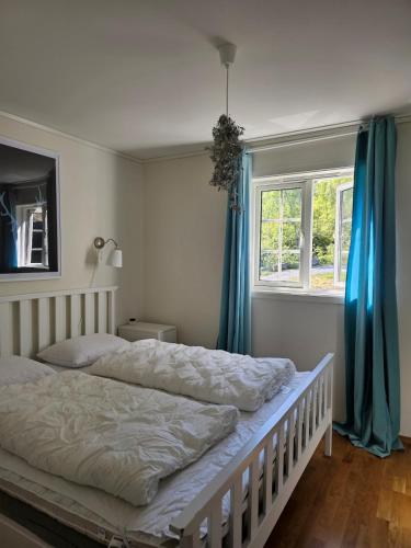 a bedroom with two beds and a window at Mountain view 1 in Håra
