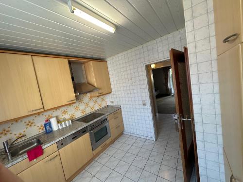 a small kitchen with a sink and a stove at Kerpen Rarität in Kerpen